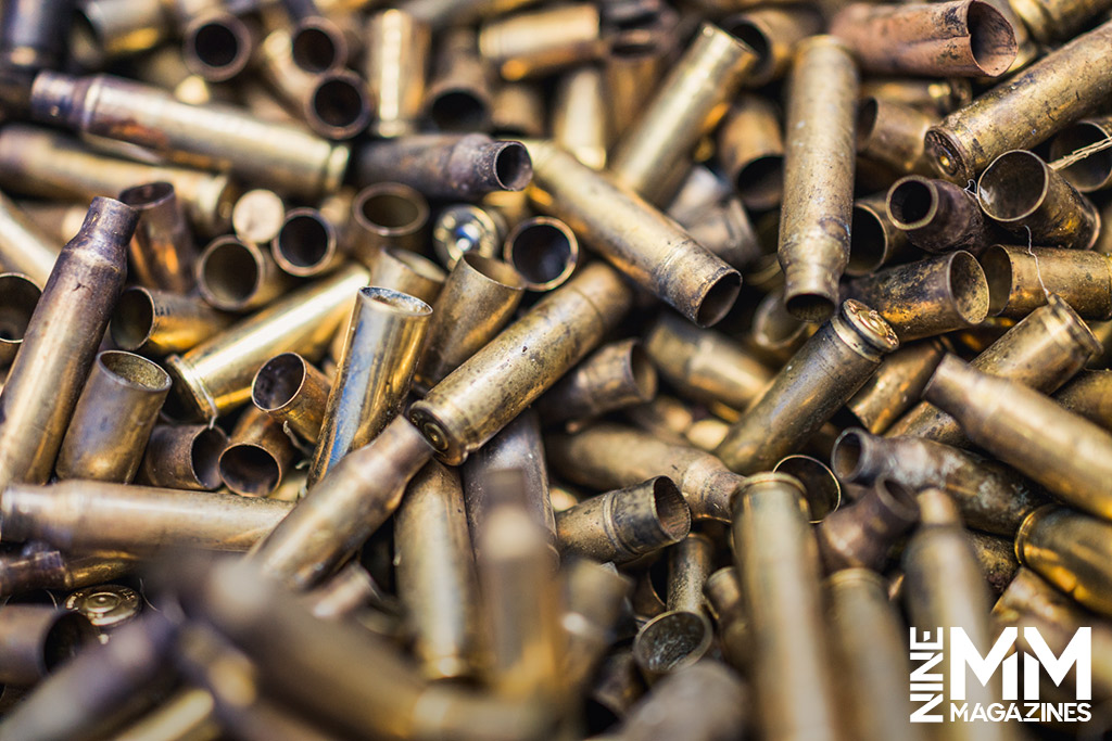 a photo of a pile of spent brass ammo cases