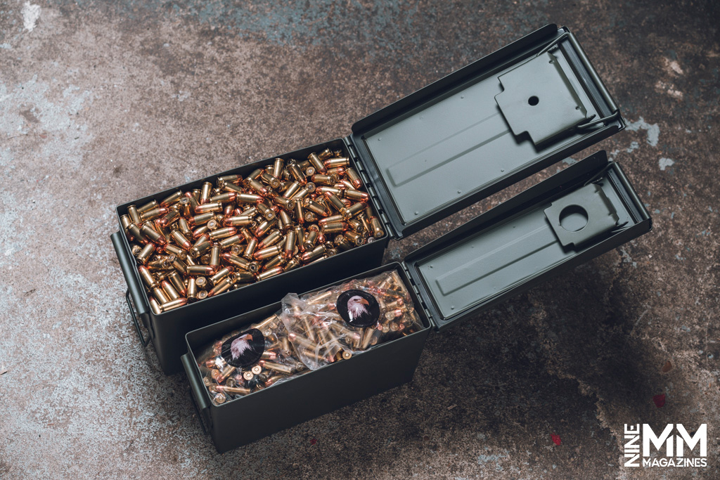 a photo of two metal ammo cans with ammo inside