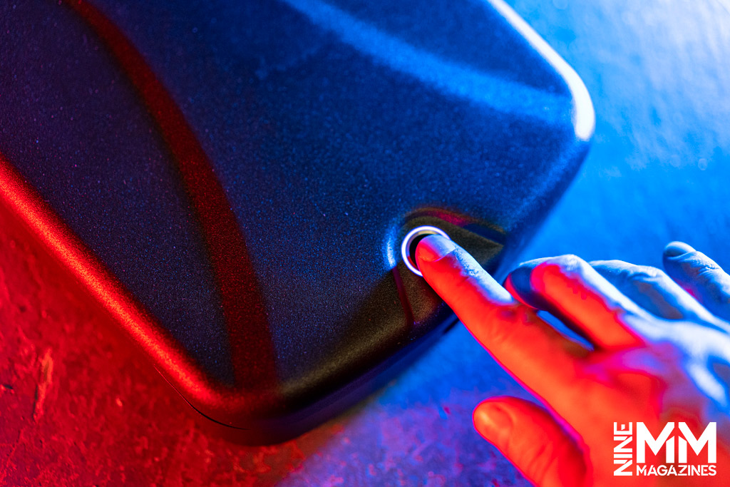 a photo of a man opening a biometric safe