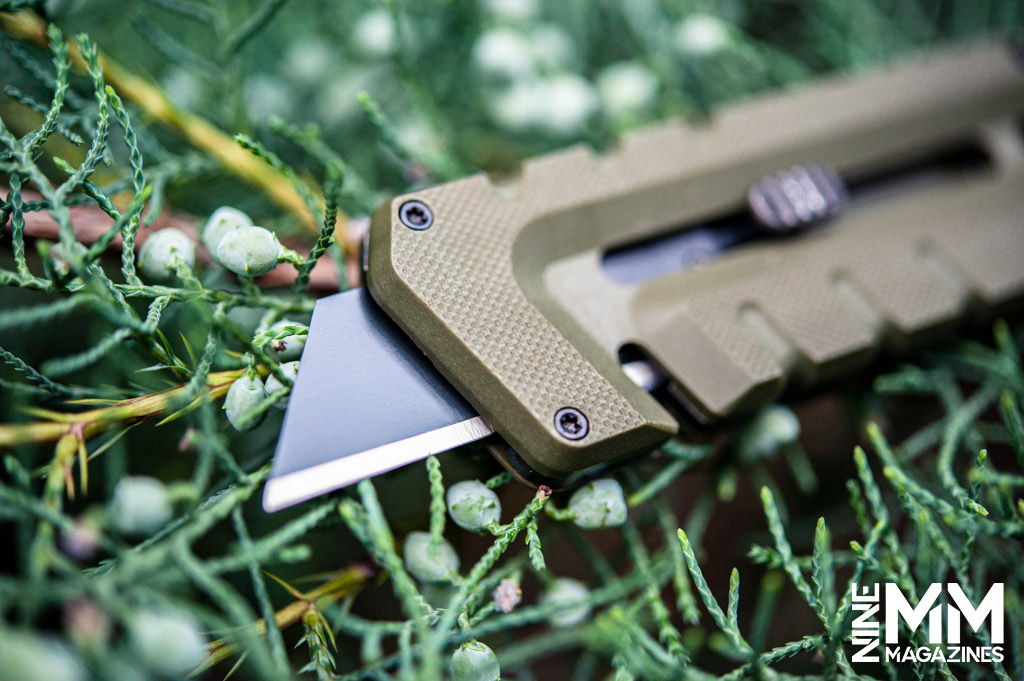 a macro photo of an OD green utility knife