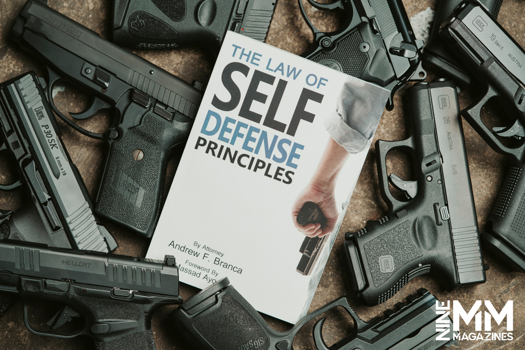 a photo of the The Law of Self-Defense Principles on a pile of handguns