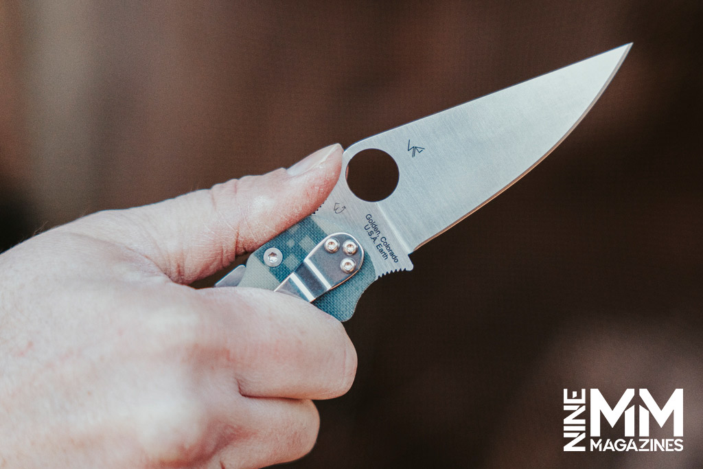 a photo of a woman's hand holding a knife