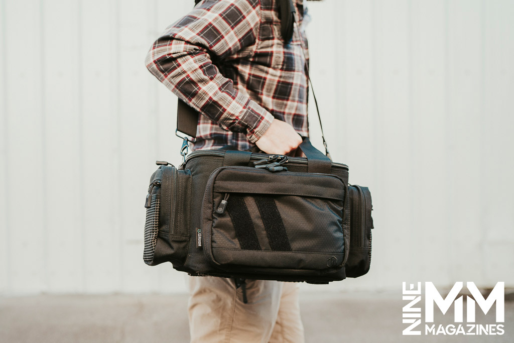 a photo of a man carrying a Savior Specialist Range Bag