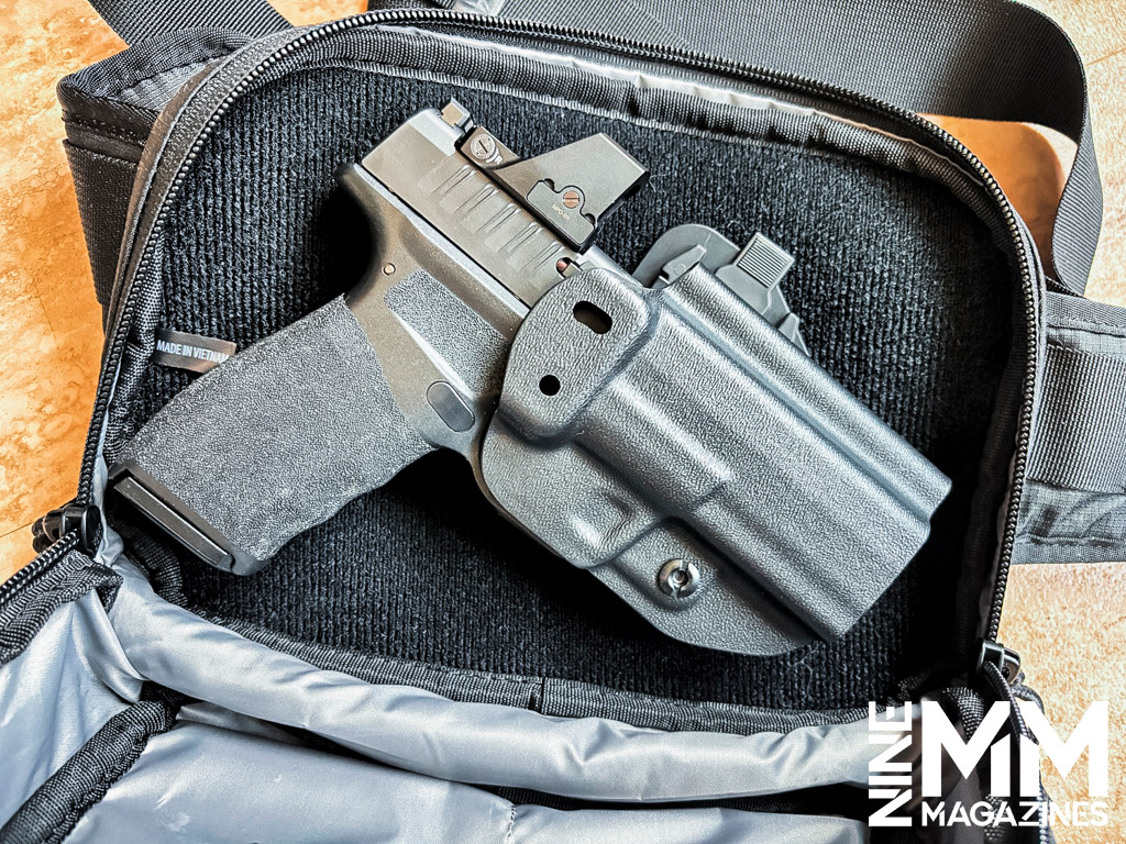 a springfield hellcat pro in a waist bag