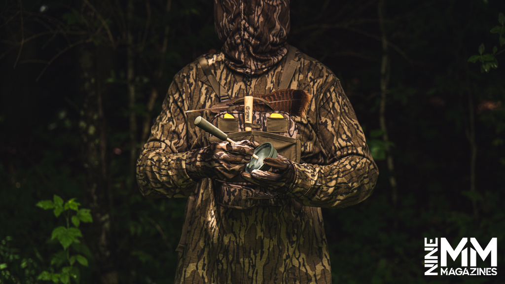 a photo of a man using a glass pot turkey call