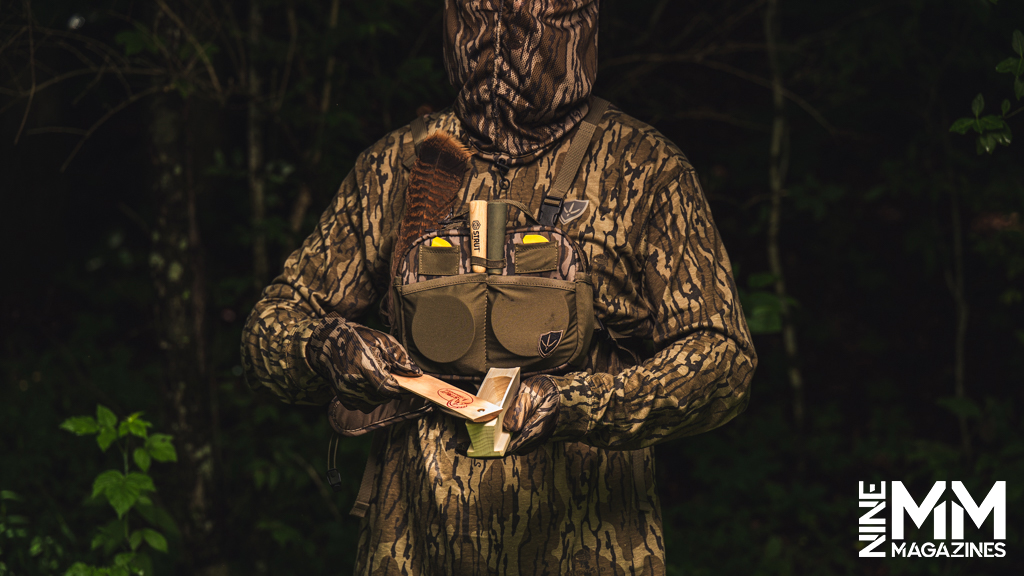 a photo of a man using a turkey box call