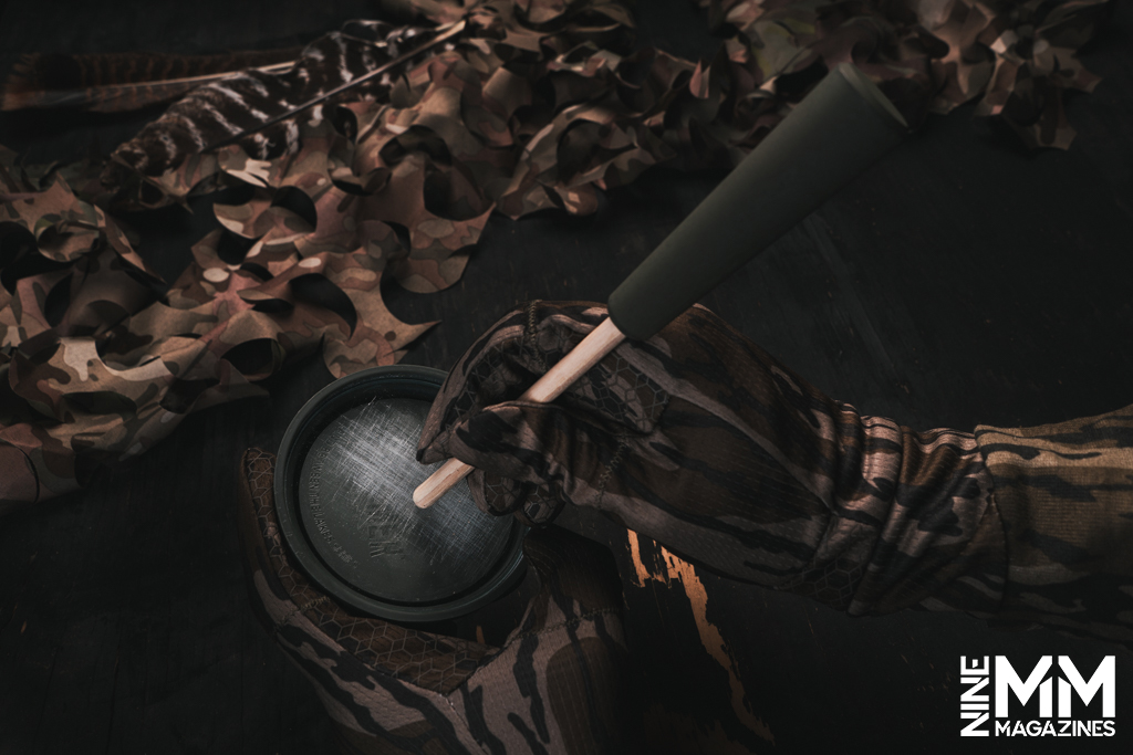 a hunter using the Glass Hammer Pot Turkey Call 