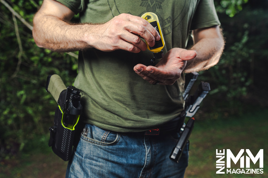 a photo of a man applying chalkless grip enhancer